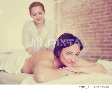 Adult woman very happy with procedure of massage 42621916