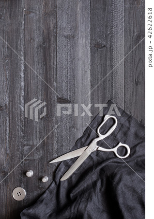 Black wooden sewing background Black wooden sewing background 42622618