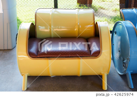 Sofa recycled from old yellow oil tank 42625974