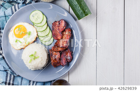 Pork tocino with rice and fried egg 42629839