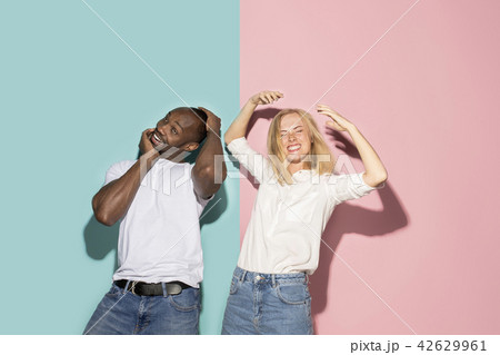 The squint eyed couple with weird expression on blue and pink studio The squint eyed couple with weird expression on blue and pink studio 42629961