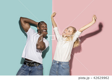 The squint eyed couple with weird expression on blue and pink studio The squint eyed couple with weird expression on blue and pink studio 42629962