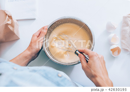 Candid image woman mixing batter 42630193