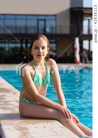 Teenage girl posing near pool 42636113
