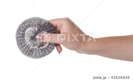 metal sponge for utensils in a female hand metal sponge for utensils in a female hand 42636836