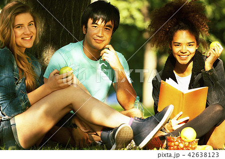 cute group of teenages at the building of university with books cute group of teenages at the building of university with books 42638123
