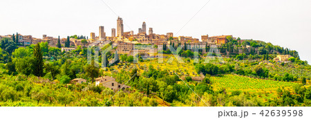San Gimignano - medieval town with many stone towers, Tuscany, Italy. Panoramic view of cityscape San Gimignano - medieval town with many stone towers, Tuscany, Italy. Panoramic view of cityscape 42639598