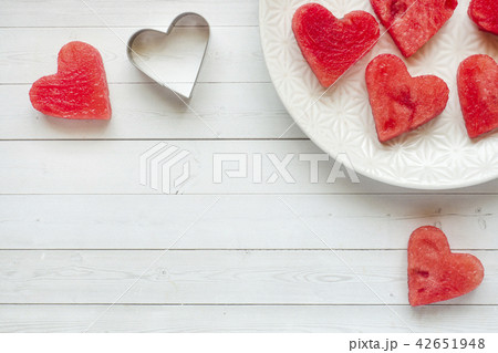 Hearts carved out of watermelon. Hearts carved out of watermelon. 42651948