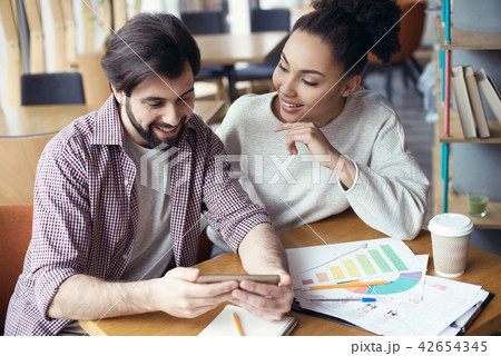 Young people coworking together at creative office sitting guy s 42654345