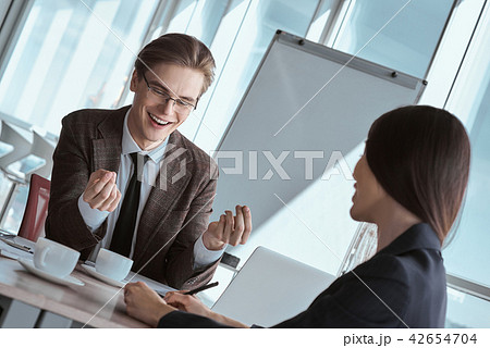 Businesspeople at office working together sitting discussing wor 42654704