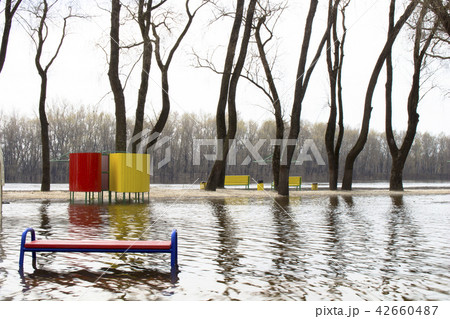 The river spilled from its banks. Water flooded. 42660487