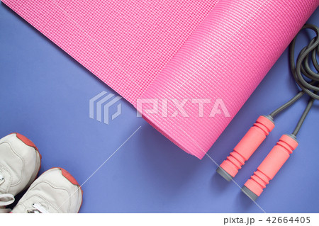 Sport and fitness equipments on purple colour 42664405