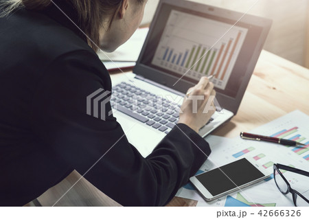 Businesswoman working on Desk office Businesswoman working on Desk office 42666326