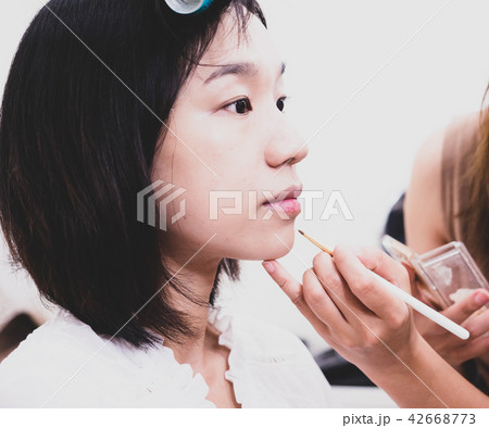 Young woman with makeup cosmetics 42668773