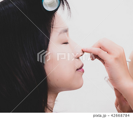 Young woman with makeup cosmetics 42668784