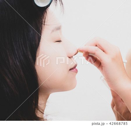 Young woman with makeup cosmetics 42668785