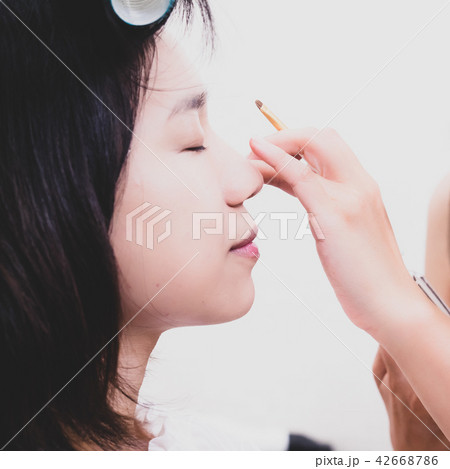 Young woman with makeup cosmetics 42668786