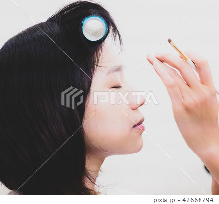 Young woman with makeup cosmetics Young woman with makeup cosmetics 42668794