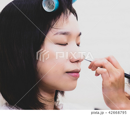 Young woman with makeup cosmetics Young woman with makeup cosmetics 42668795