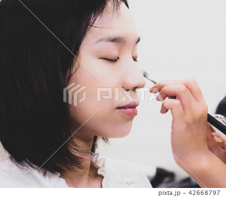 Young woman with makeup cosmetics 42668797