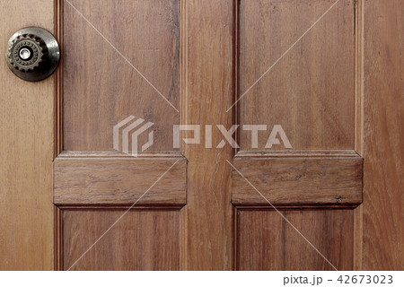 metal handle on old wooden door metal handle on old wooden door 42673023