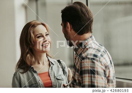 Positive woman telling with male 42680193