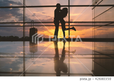 Positive man embracing cheerful lady 42680350