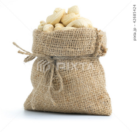 cashew nuts in burlap sack isolated on white cashew nuts in burlap sack isolated on white 42685424
