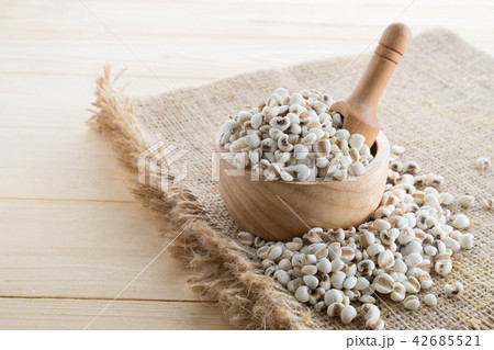Millet in on wood cup on wood Millet in on wood cup on wood 42685521