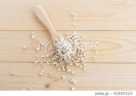 Millet in wood spoon on wood 42685523