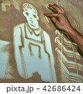 Artist paints sand 42686424