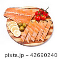 fresh red fish fillet on plate with vegetables 42690240