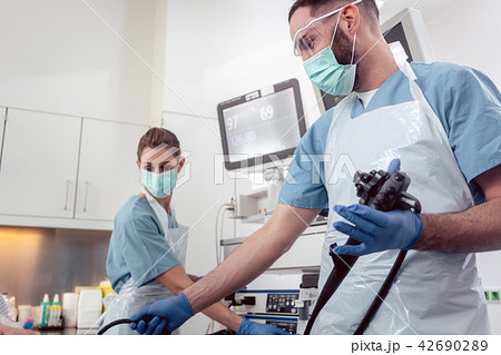 Team of doctors performing endoscopy in hospital Team of doctors performing endoscopy in hospital 42690289