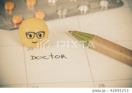 The words Doctor written on a Calendar to Remind The words Doctor written on a Calendar to Remind 42695253