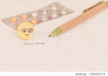 The words Doctor written on a Calendar to Remind The words Doctor written on a Calendar to Remind 42695255
