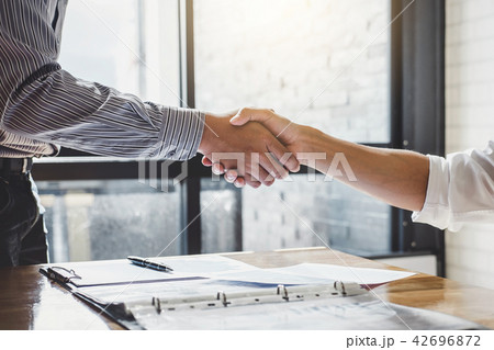Successful of businessmen handshaking and business people after 42696872