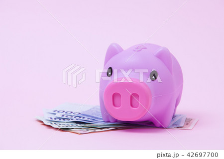 Pink Piggy bank on soft pink background with korea Pink Piggy bank on soft pink background with korea 42697700