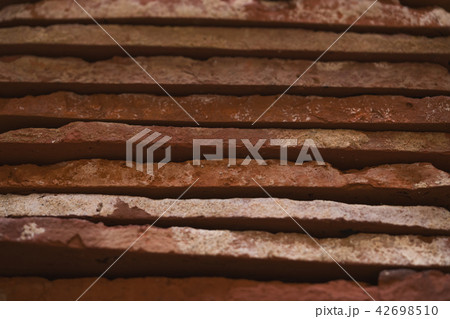 closeup stacked old brick cut tiles closeup stacked old brick cut tiles 42698510