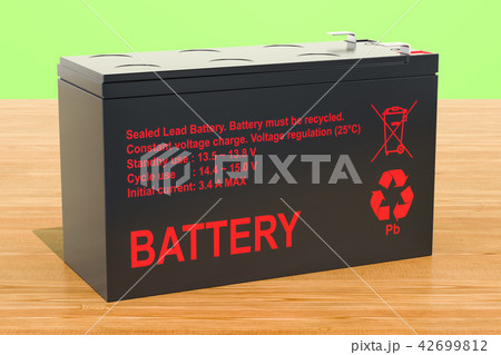 Sealed UPS battery on the wooden background Sealed UPS battery on the wooden background 42699812