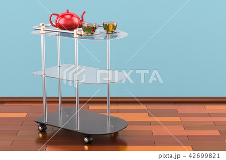 Serving cart with cups of tea and teapot 42699821