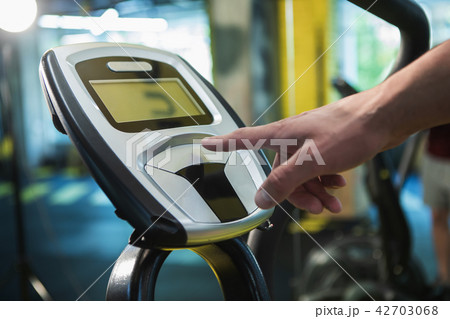 Man is using sport machine with board 42703068