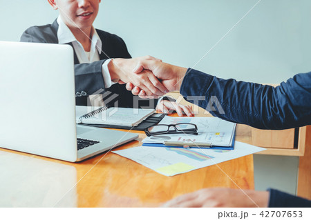 Business people colleagues shaking hands meeting Business people colleagues shaking hands meeting 42707653