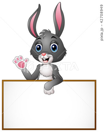 Cartoon bunny waving hand with holding blank sign 42708949