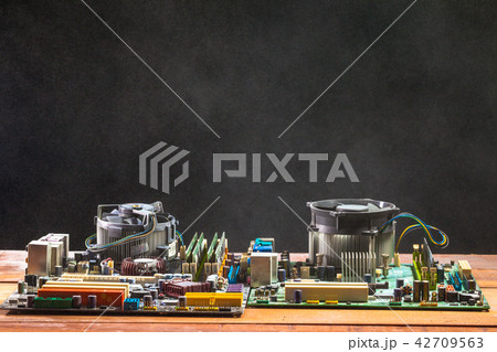 computer mainboard on wooden table 42709563
