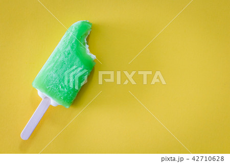 Bite Ice cream lemon on yellow background 42710628