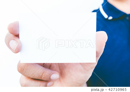 Man hand  holding a blank business card  42710965