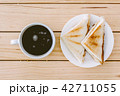 Sandwich with coffee cup on wooden table 42711055