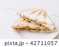 Sandwich on wooden table 42711057