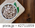 Minced meat on wooden table 42711059