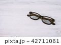 Fashion sunglasses on wooden table 42711061